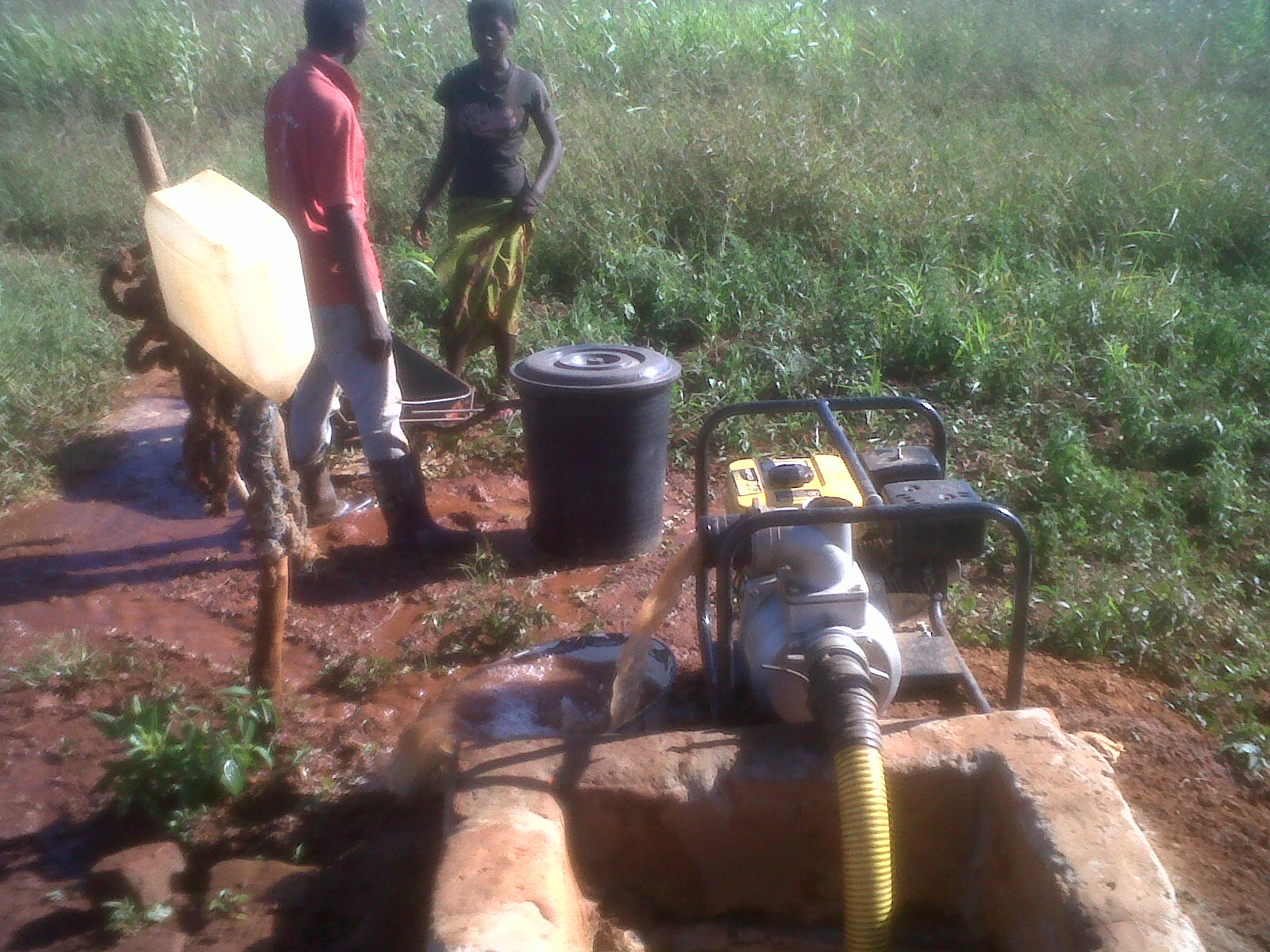 A farm water well with a pump